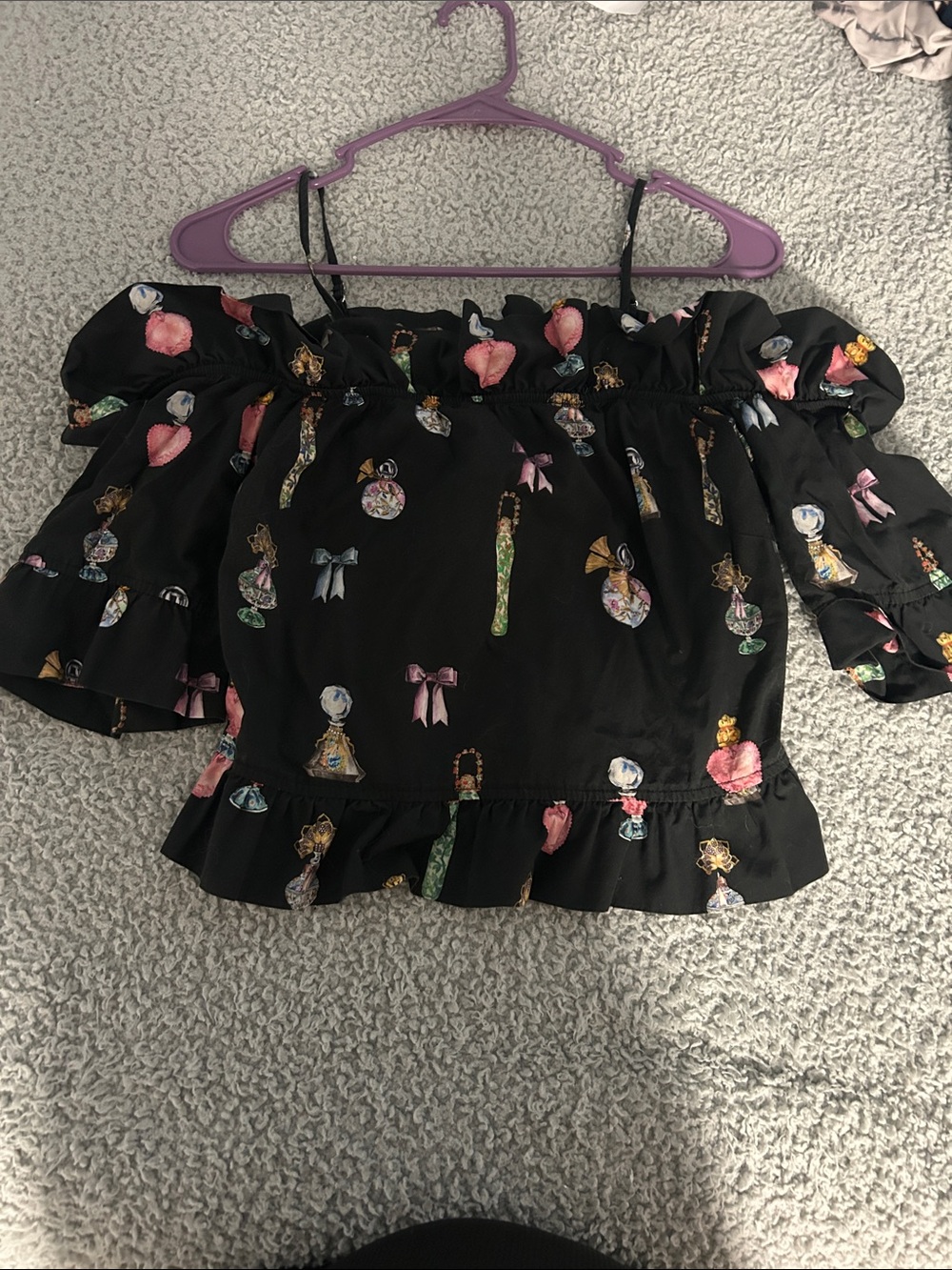 H&M Black Off-Shoulder Ruffle Top with Perfume Bottle & Bow Print